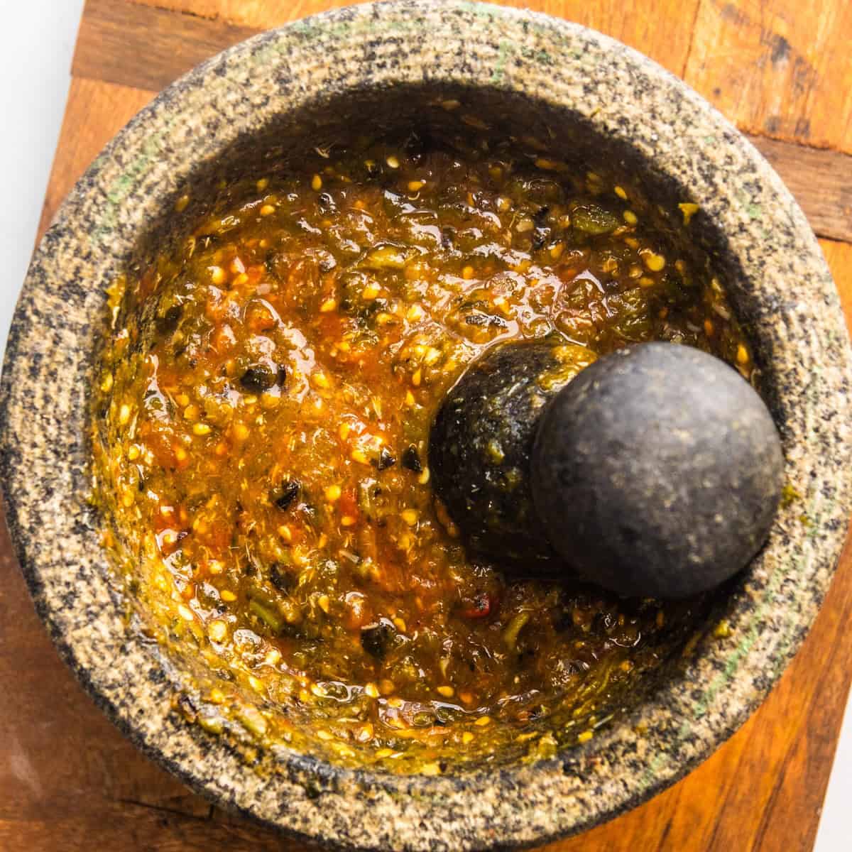 Molcajete salsa in a large molcajete.