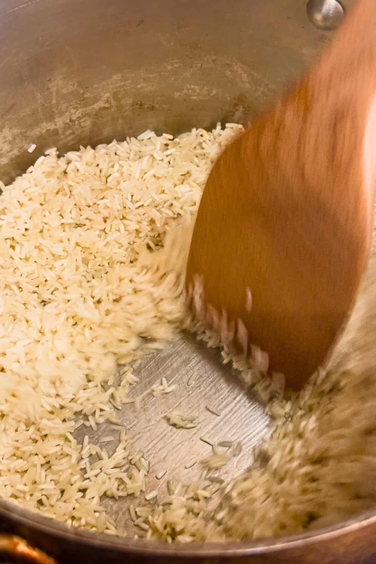 Rice toasting in a pan.
