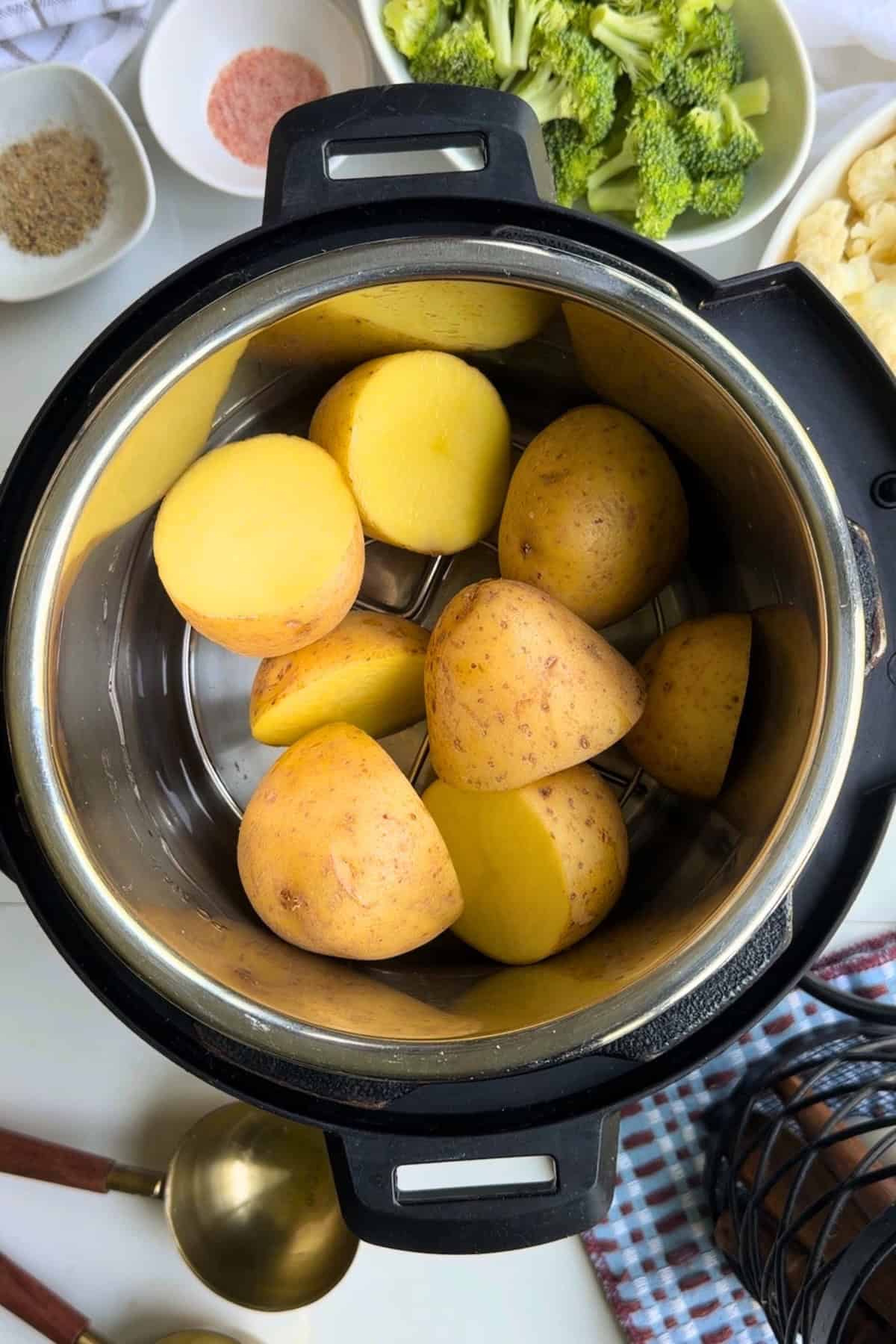 Potatoes and water in an Instant Pot.