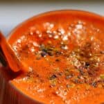 Sweet Orange Elixir in a glass topped with chia seeds.