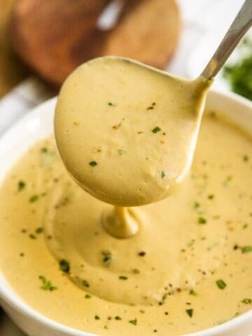 Creamy cashew gravy in a white bowl.