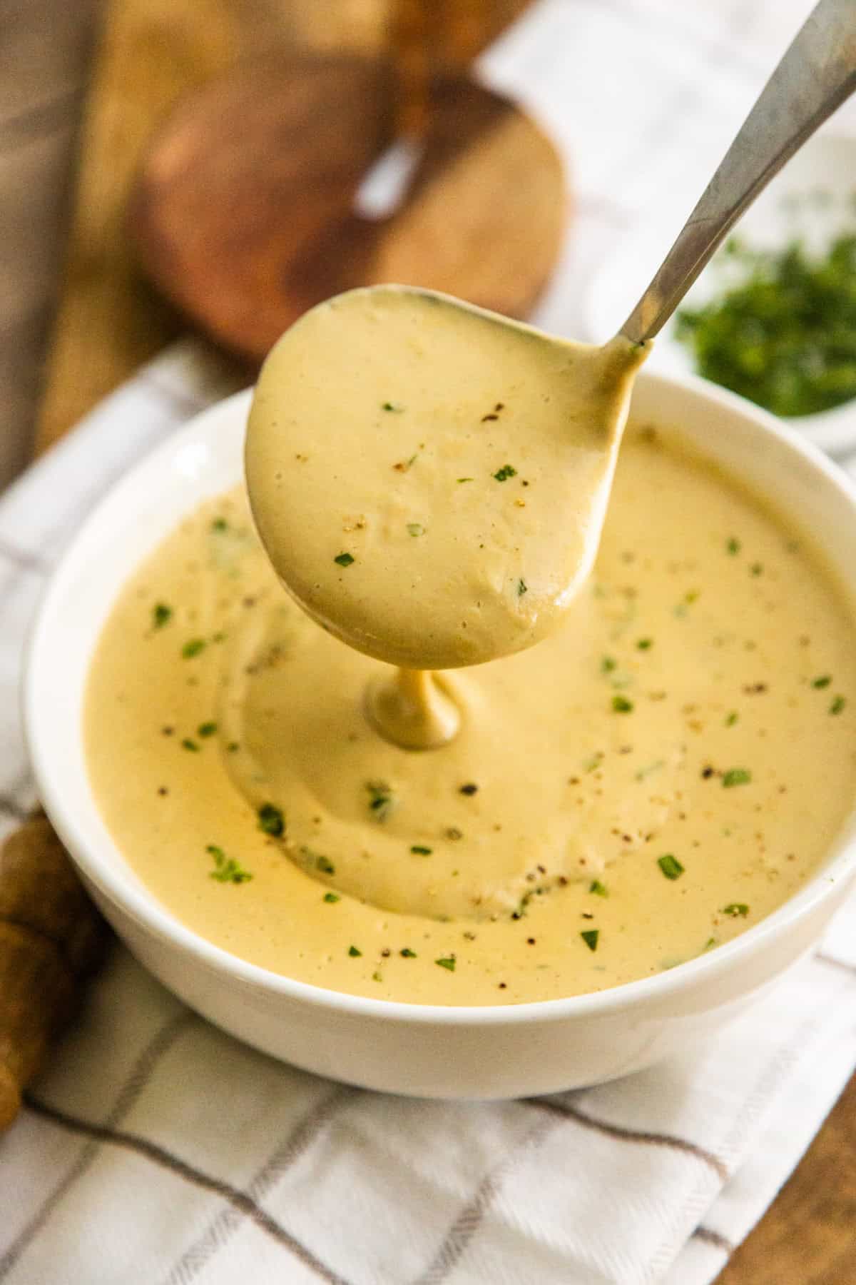 Creamy cashew gravy in a white bowl.