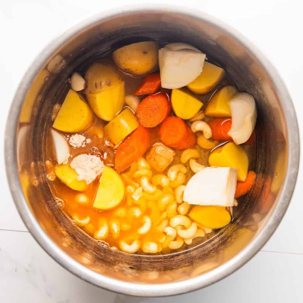 Chopped vegetables and seasonings in an Instant Pot.