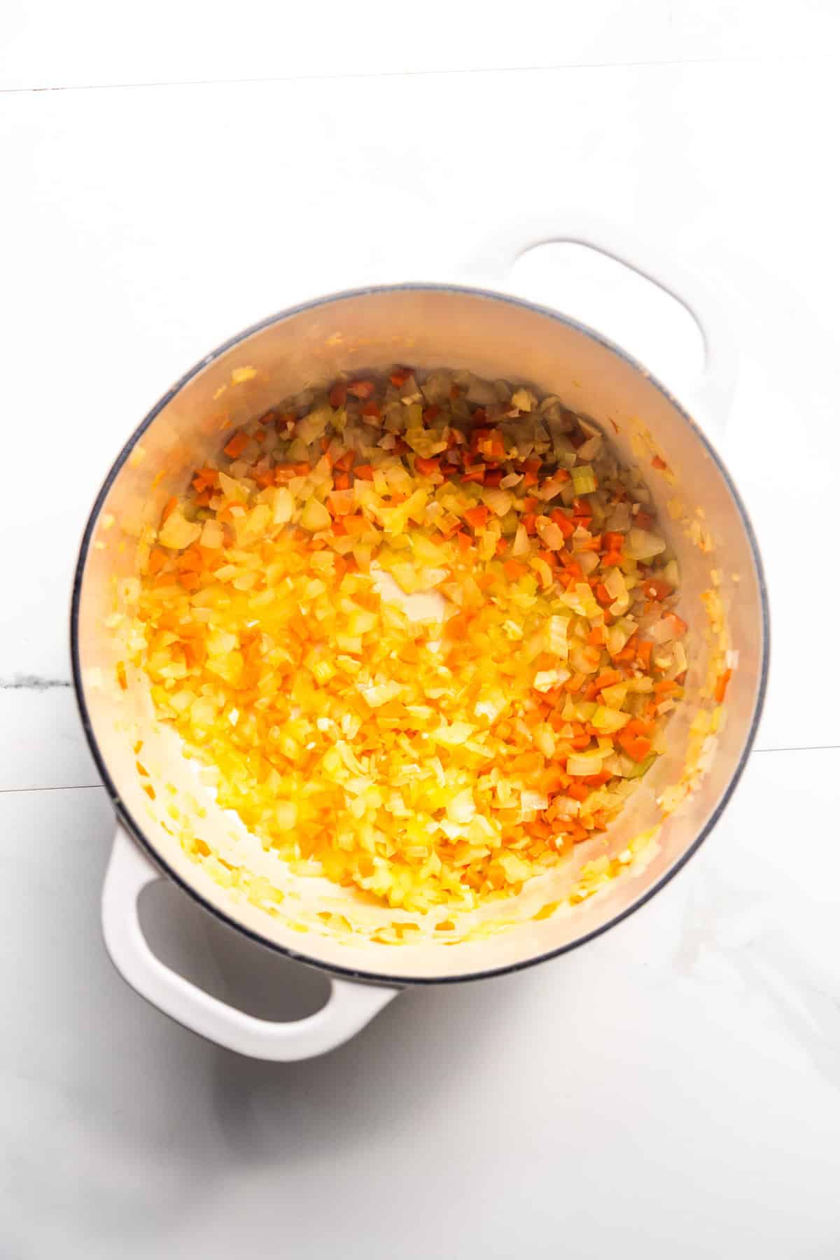 Sautéed vegetables in a pan.