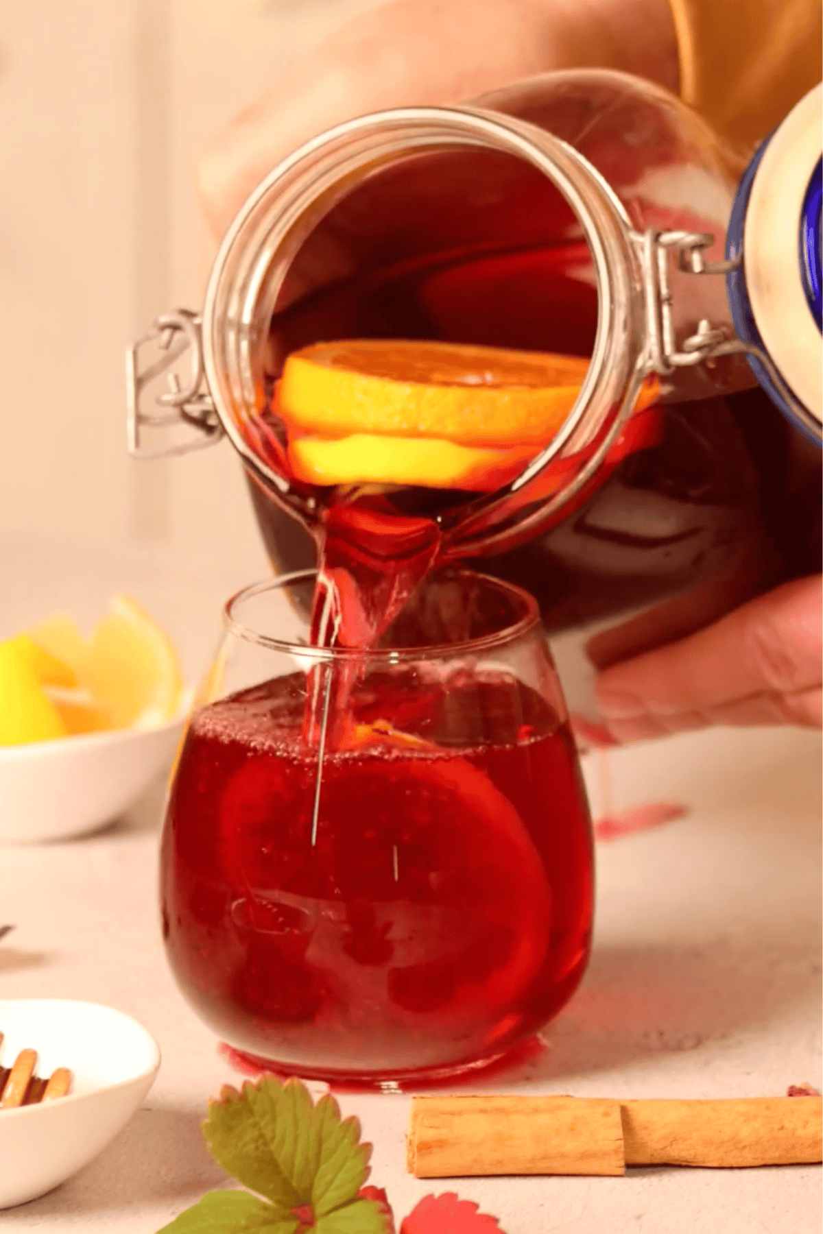 Iced hibiscus tea pouring into a glass.