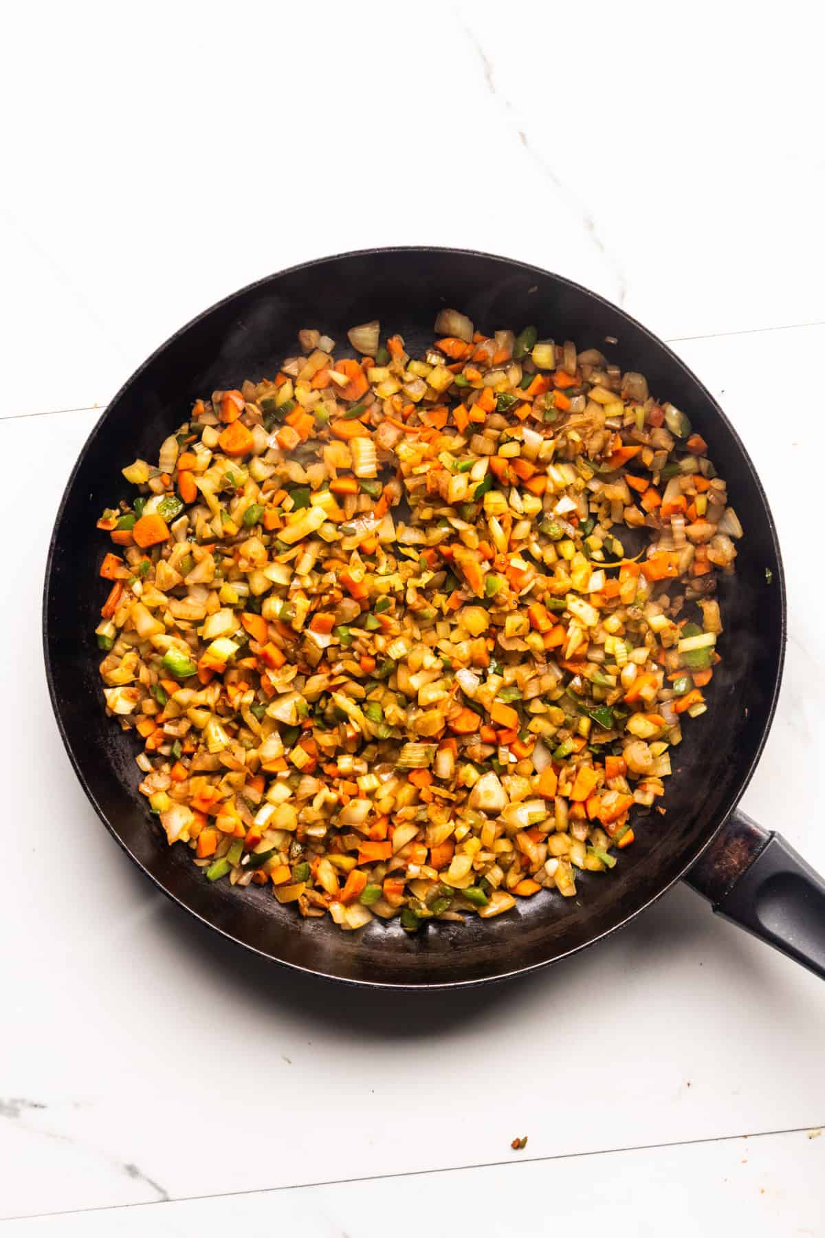 Sautéed vegetables in a pan.