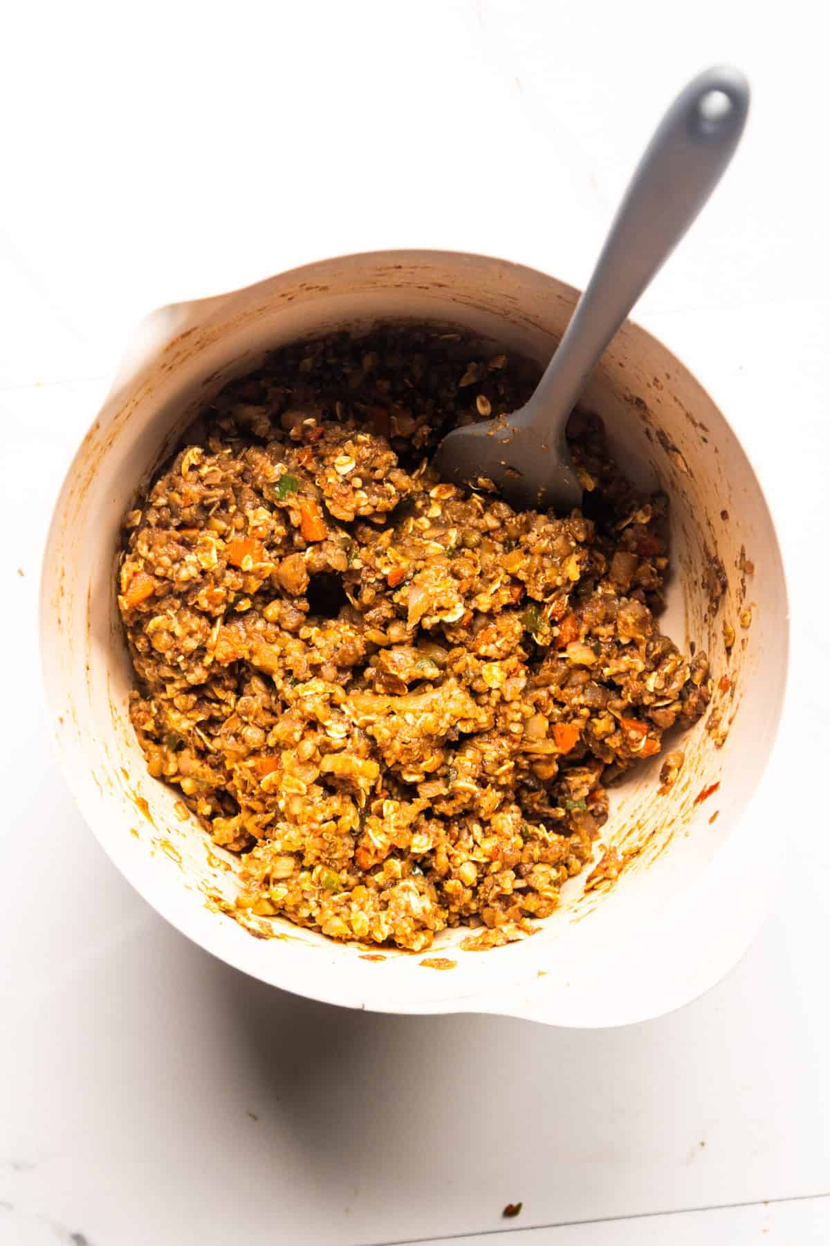 Vegan meatloaf base in a bowl being mixed.