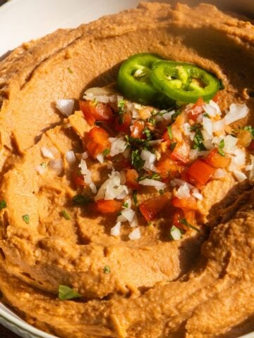Vegan bean dip in a white bowl.