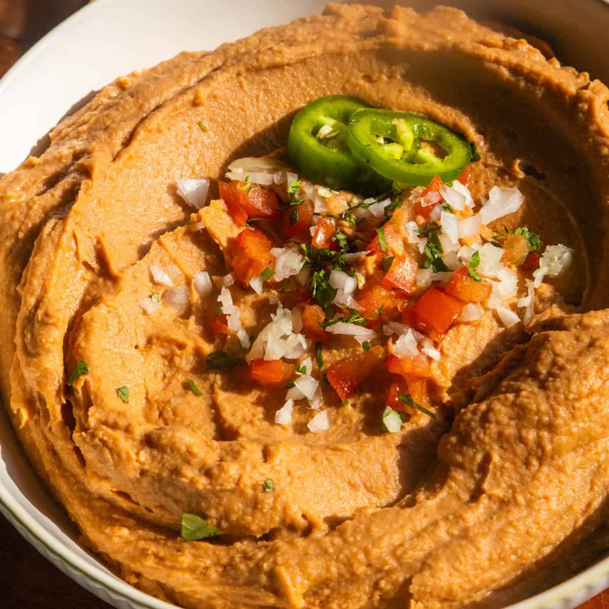 Vegan bean dip in a white bowl.