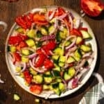 Cucumber tomato salad on a plate.