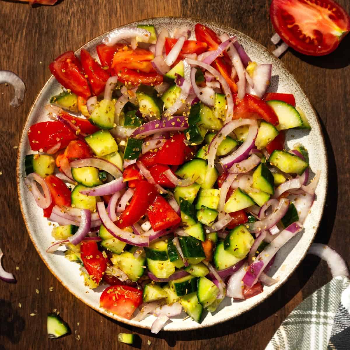 Cucumber tomato salad on a plate.