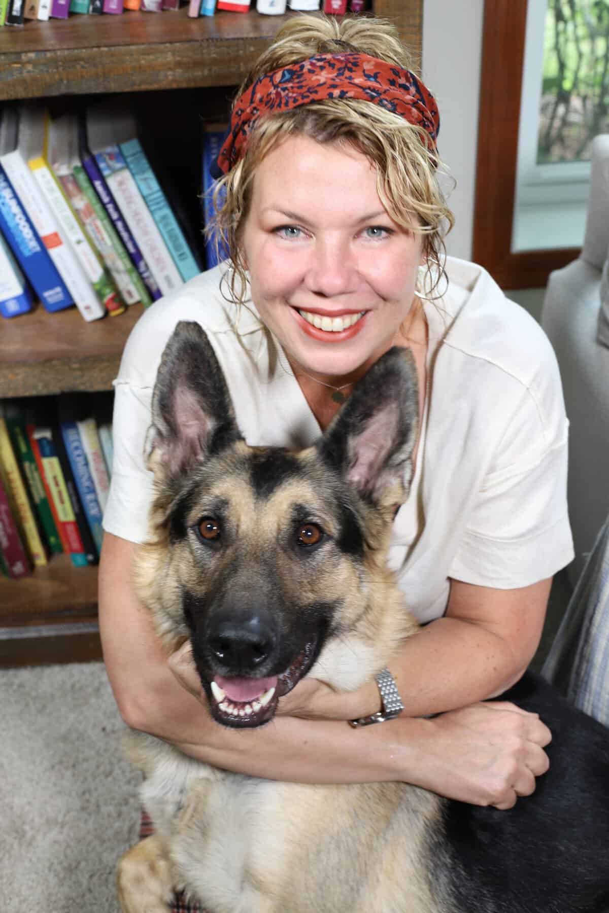 Julie Gaeta smiling with her dog.