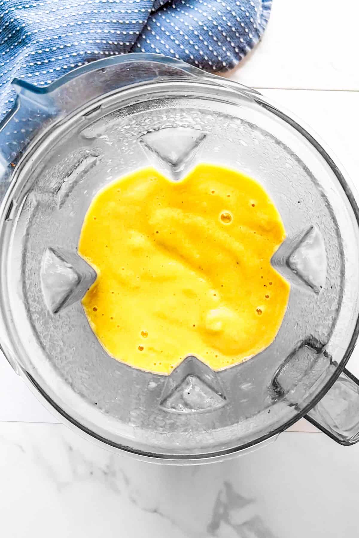 All ingredients for dairy-free orange creamsicle smoothie recipe blended.