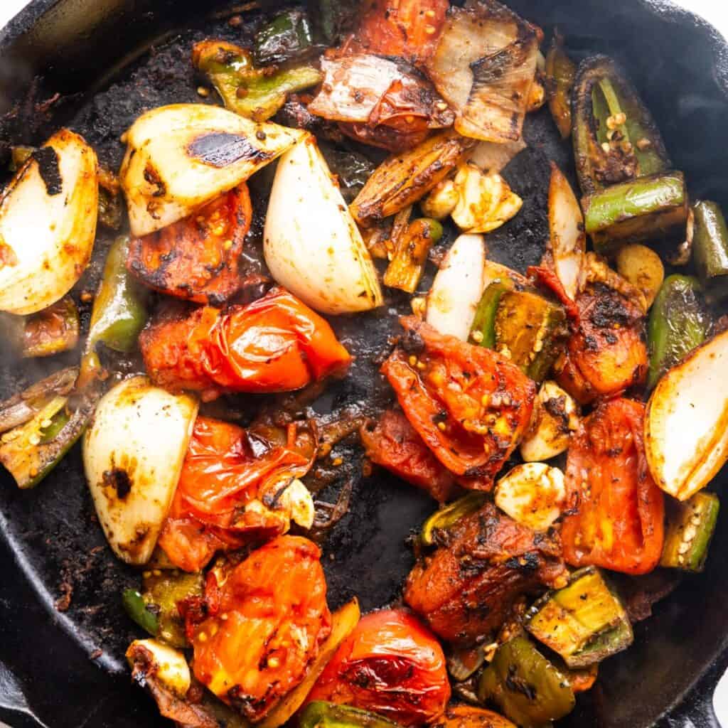 Roasted veggies in a cast iron pan.