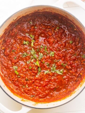 Hearty marinara sauce in a dutch oven.