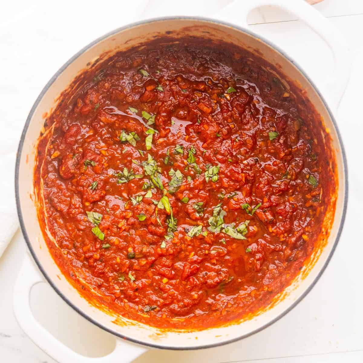 Hearty marinara sauce in a dutch oven.