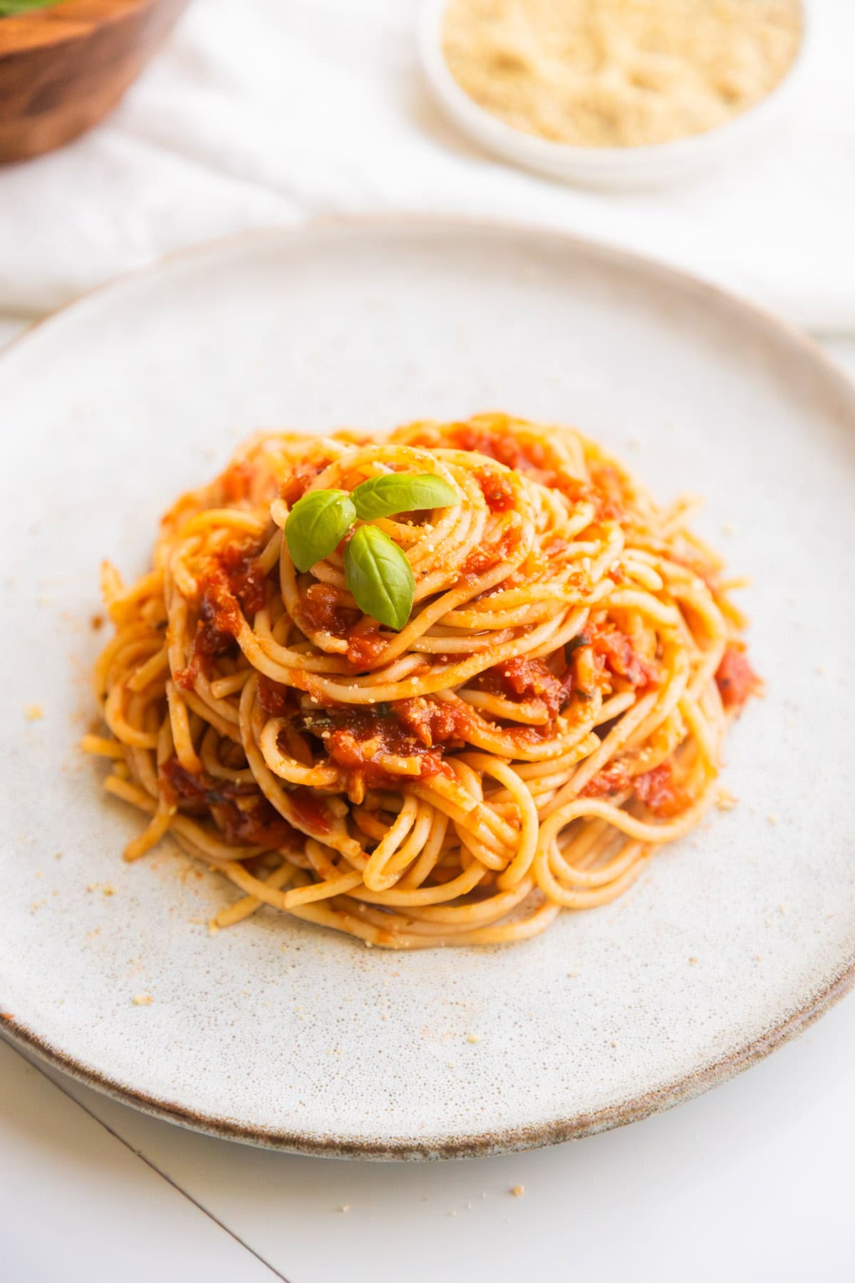 Vegan hearty marinara sauce served with pasta on a plate.