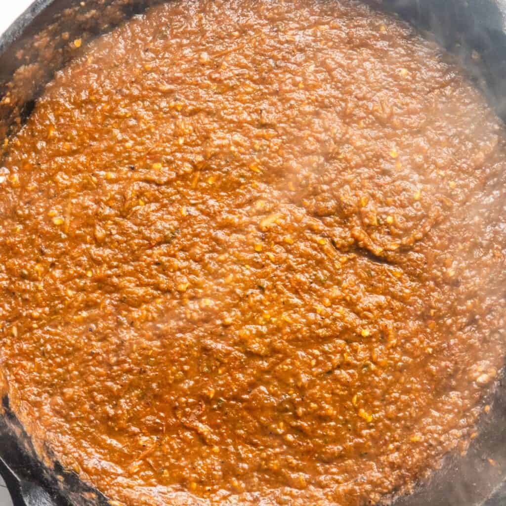 Roasted red salsa in a cast-iron pan.