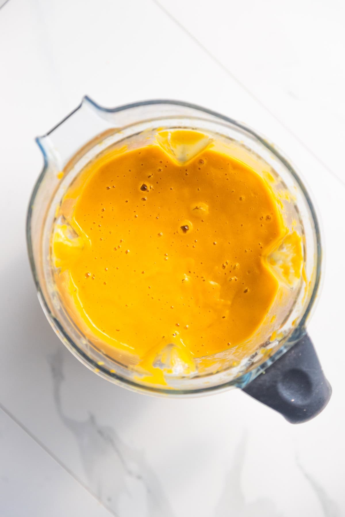 Vegan nacho cheese sauce finished in a blender.
