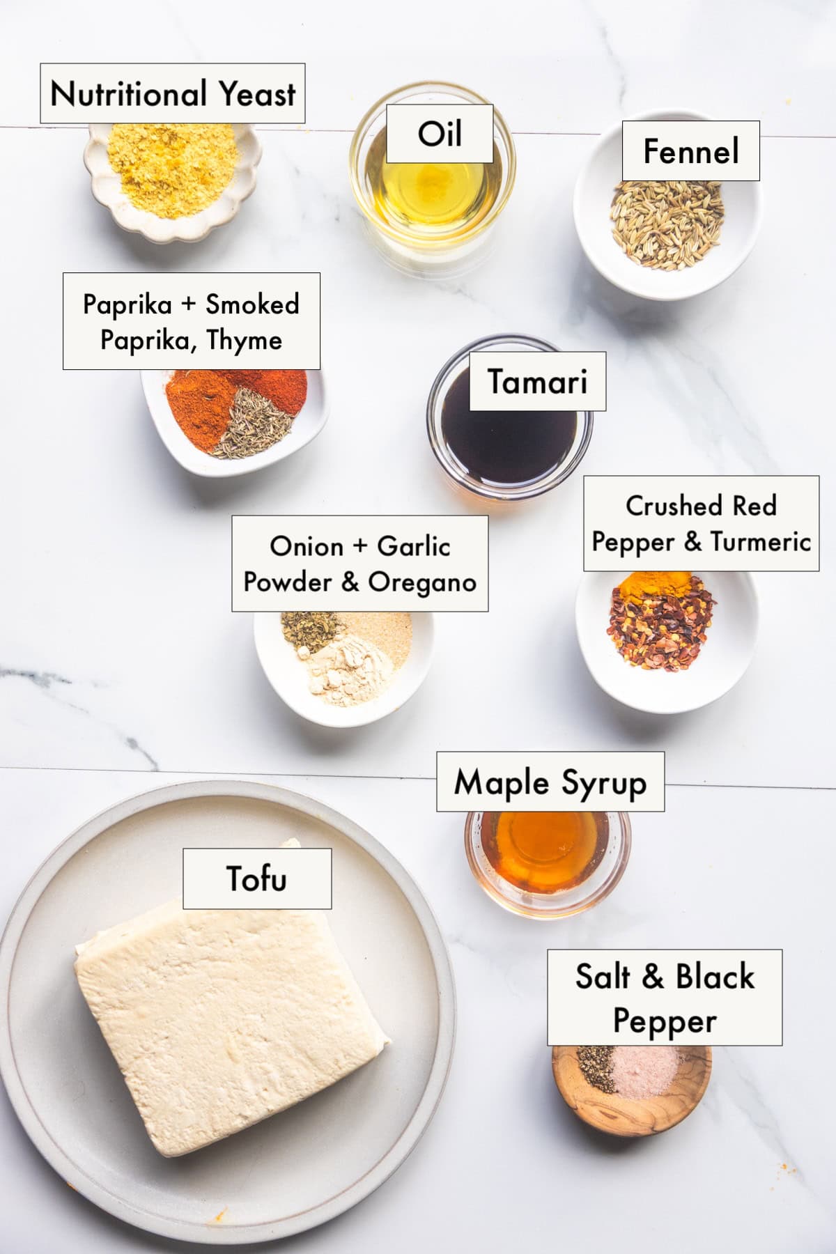 All ingredients for vegan sausage crumbles recipe in labeled bowls.