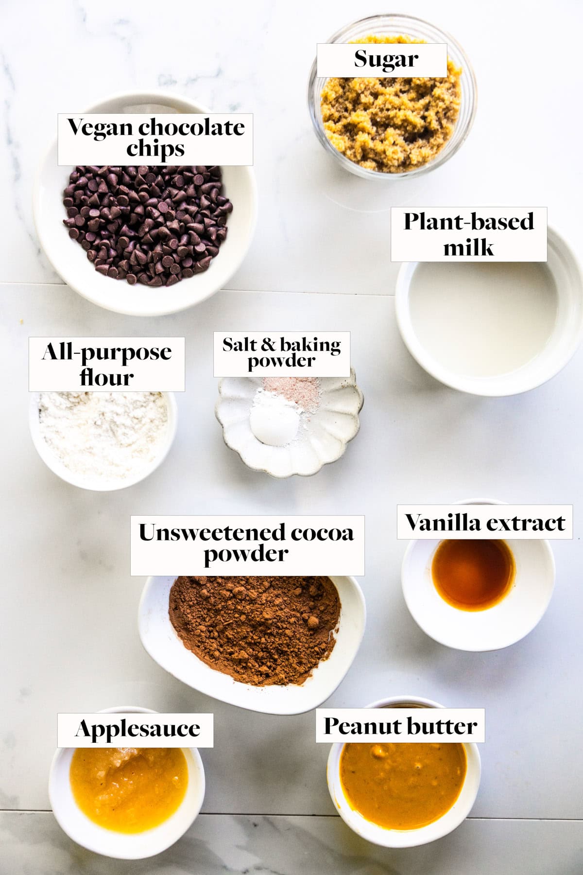 Ingredients for Vegan Chocolate Mug Cake in labeled bowls.