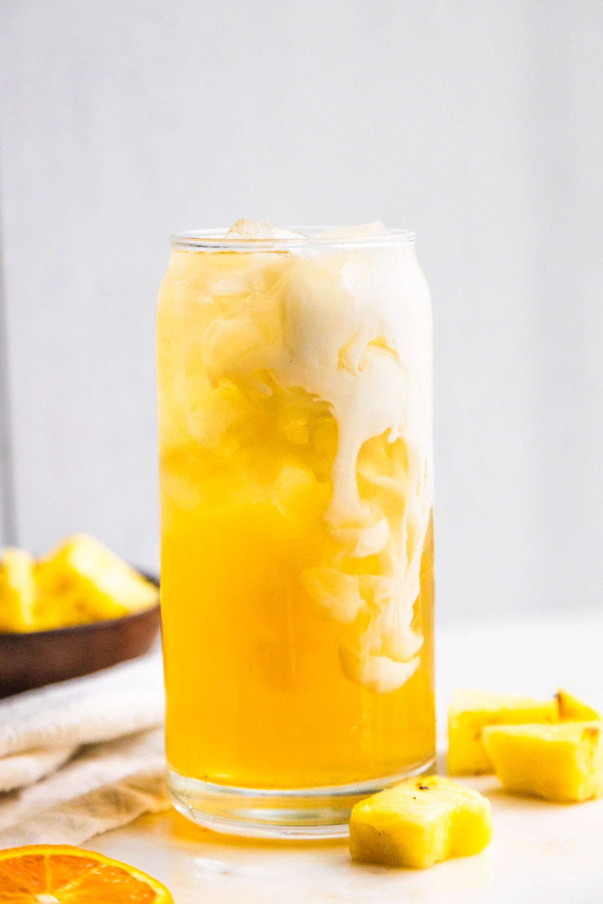 Pineapple skin tea with a splash of oatmilk.