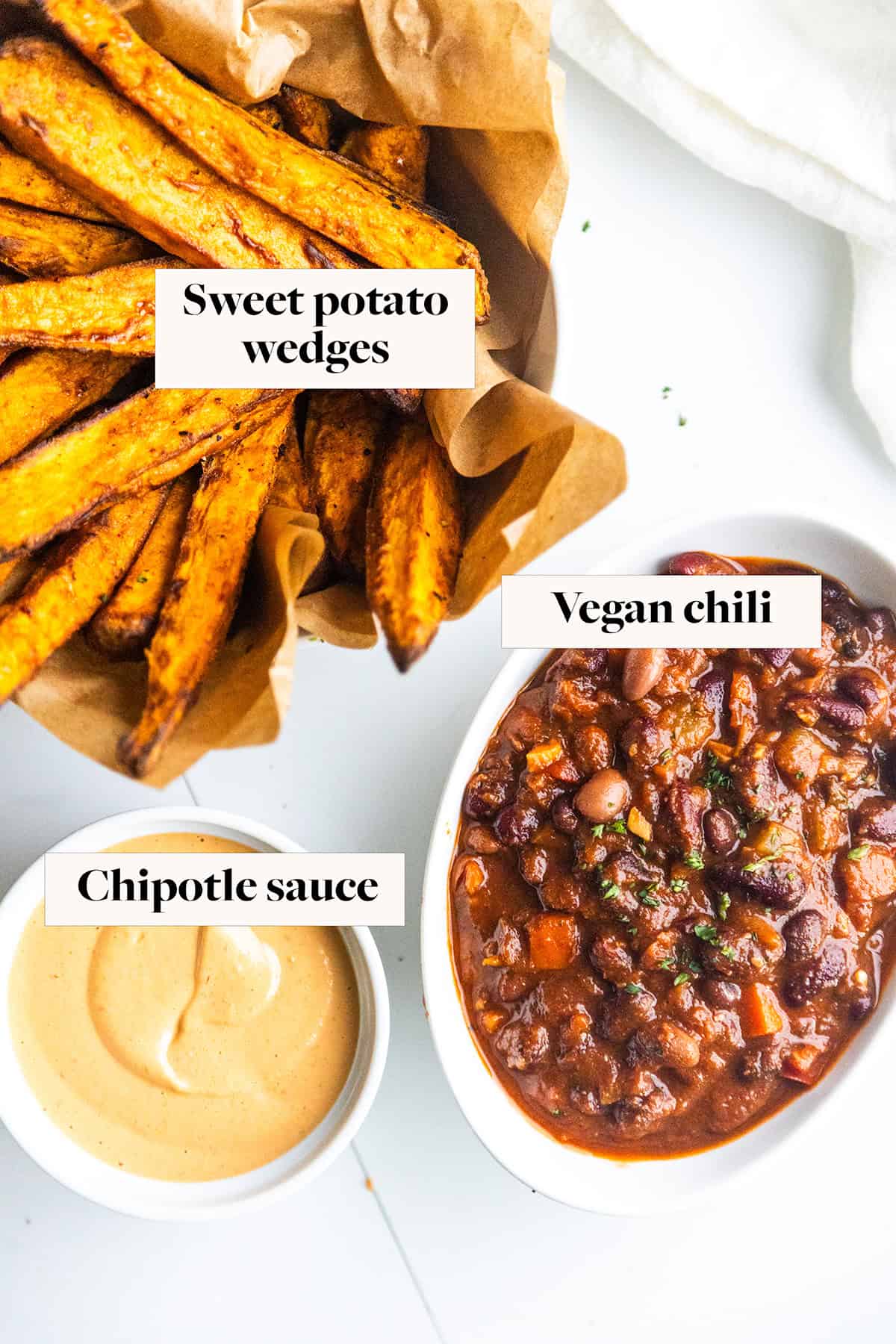 Labeled ingredients for vegan chili loaded sweet potato fries in bowls.