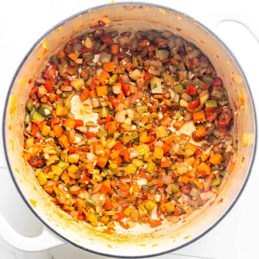 Vegetables deglazing in a pot.