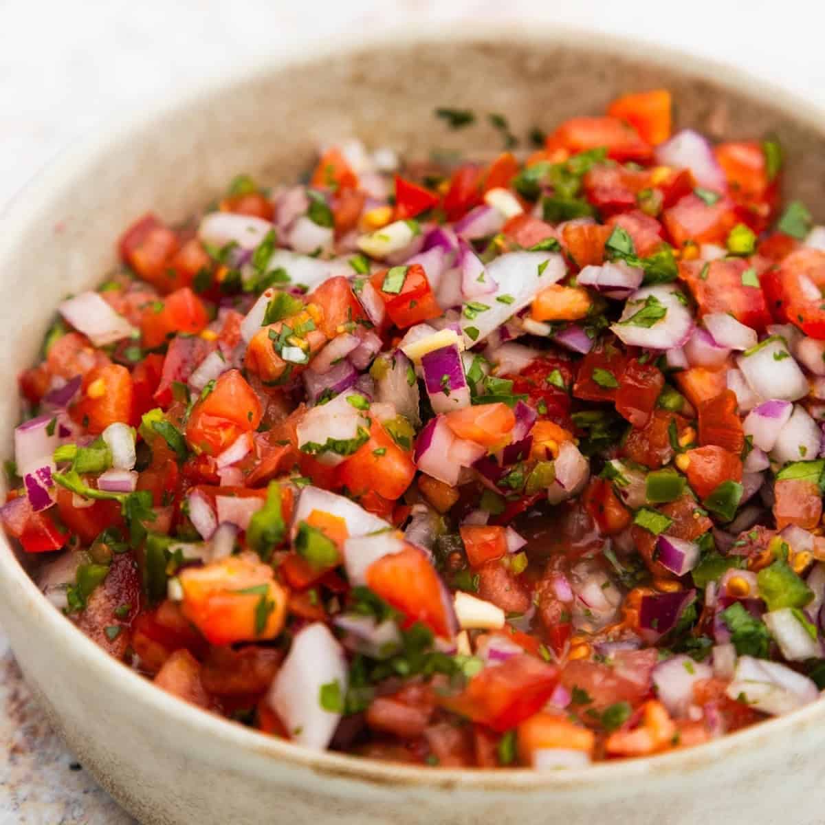 Restaurant-style pico de gallo in a bowl.