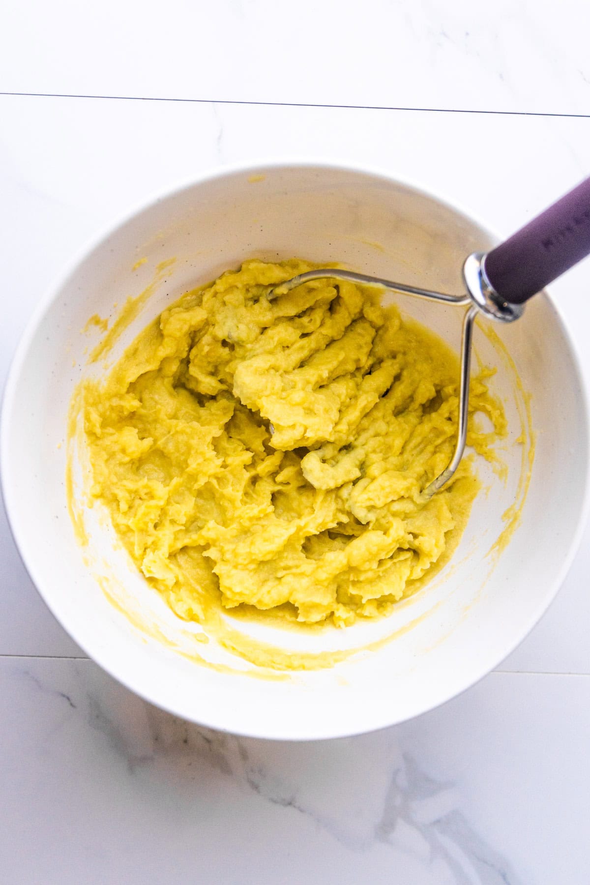The filling for crispy potato tacos in a bowl.