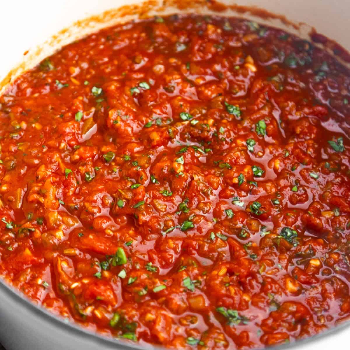 Veg loaded vegan spaghetti sauce in a dutch oven.