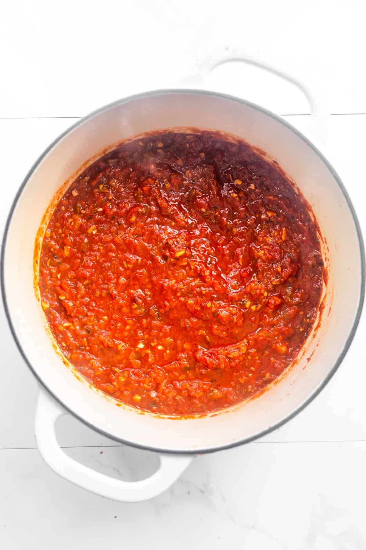 Veg loaded vegan spaghetti sauce in a dutch oven, done simmering.