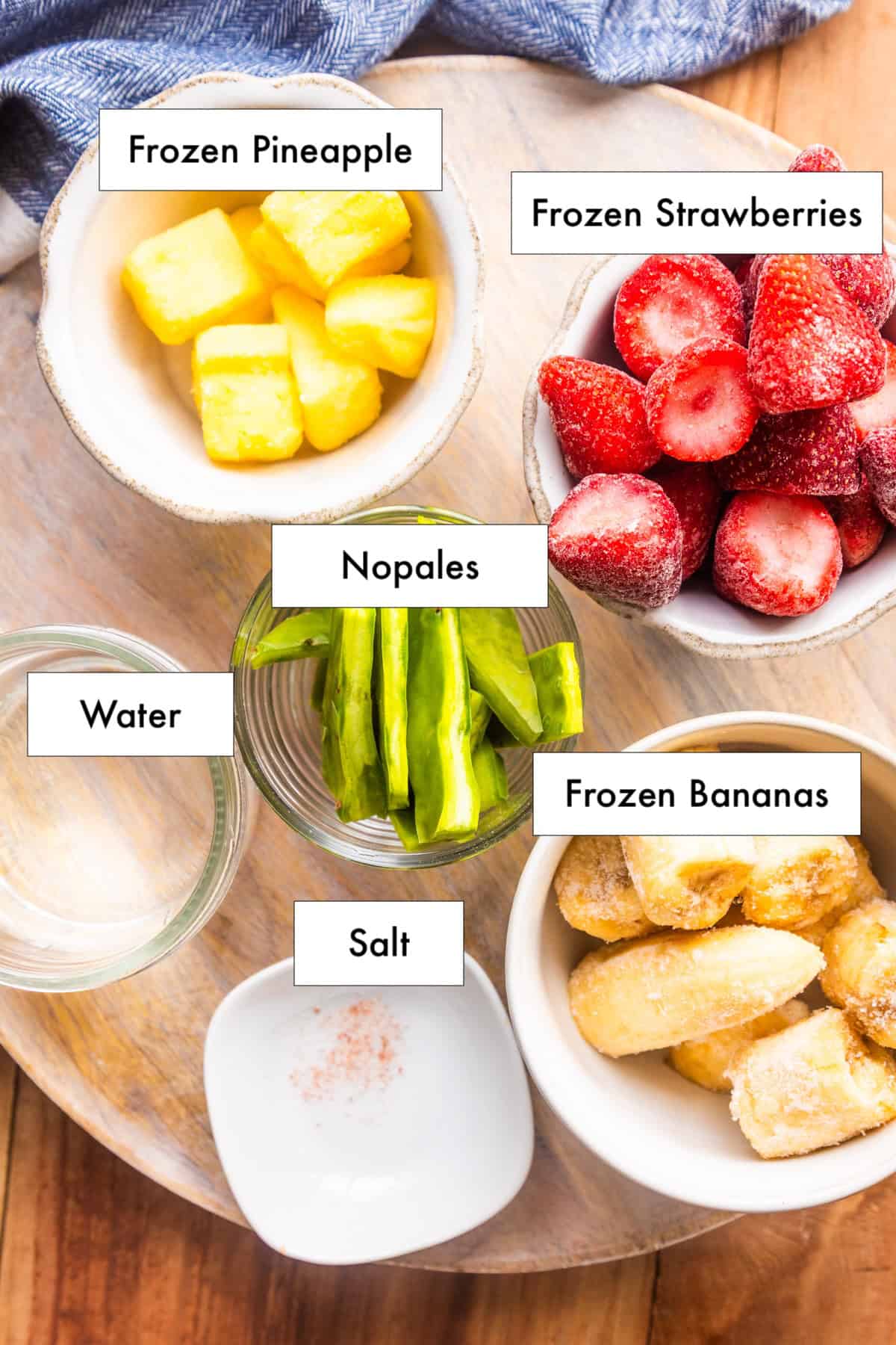 Ingredients for cactus smoothie recipe (licaudo de nopales) laid out on a counter.