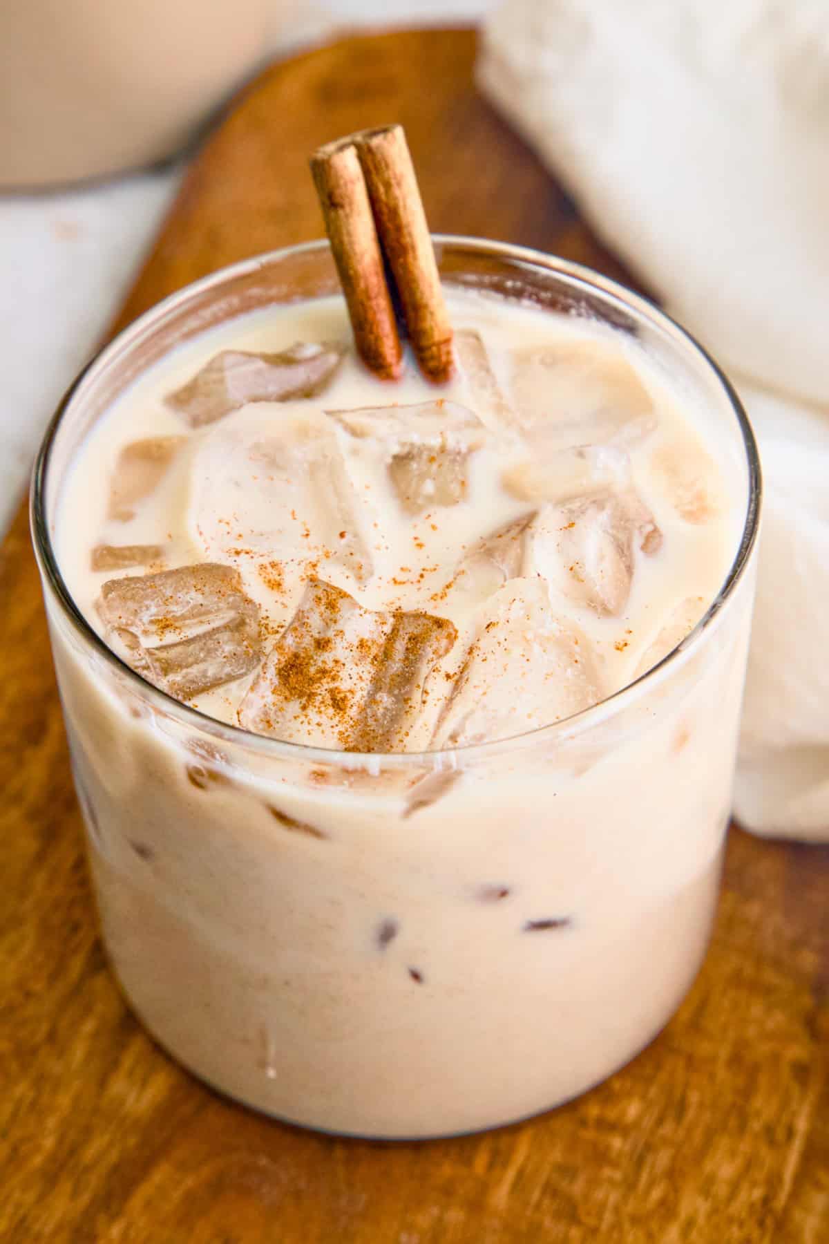 Vegan horchata (Mexican rice milk) in a glass topped with cinnamon.