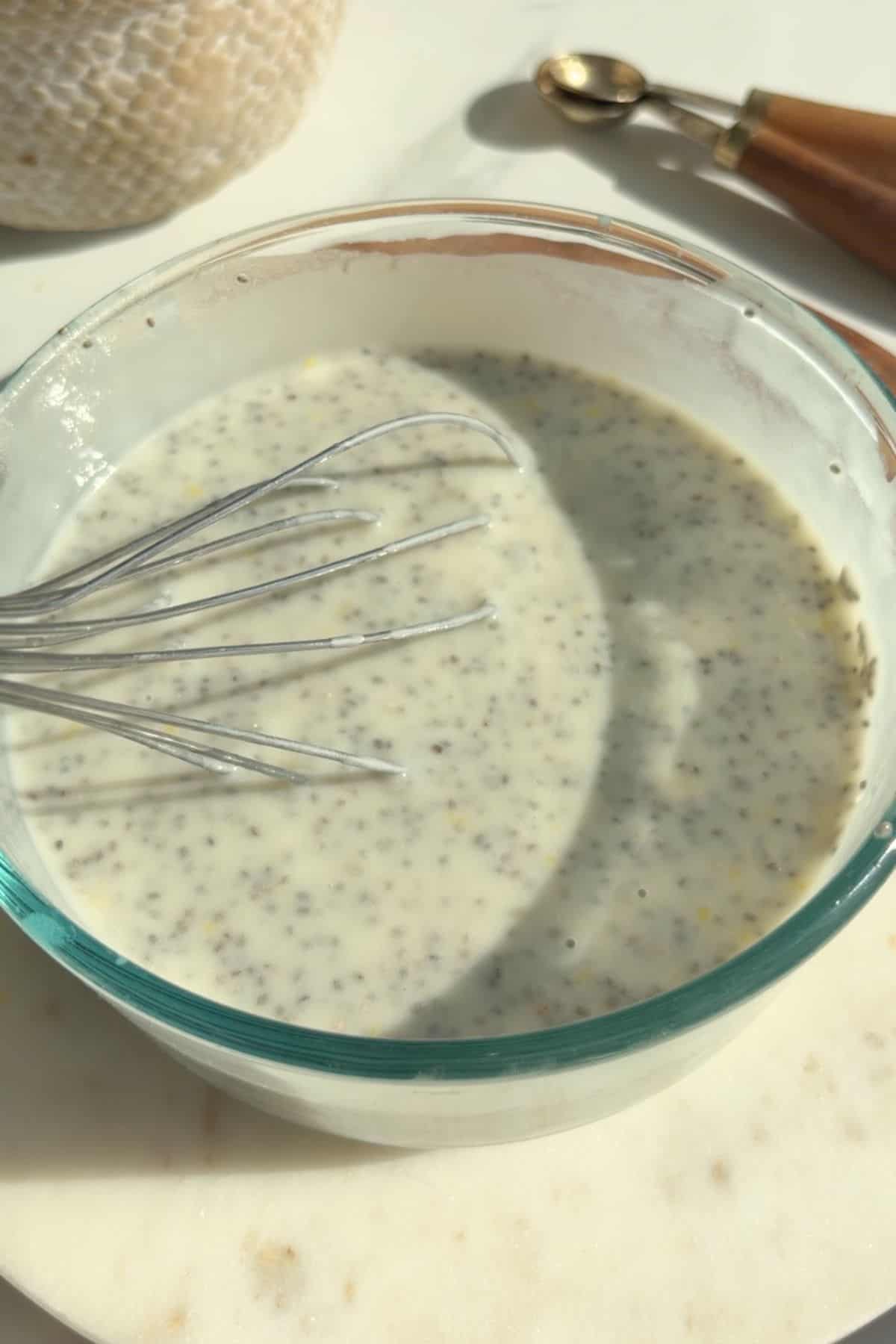 Lemon blueberry chia pudding in a bowl before chilling.
