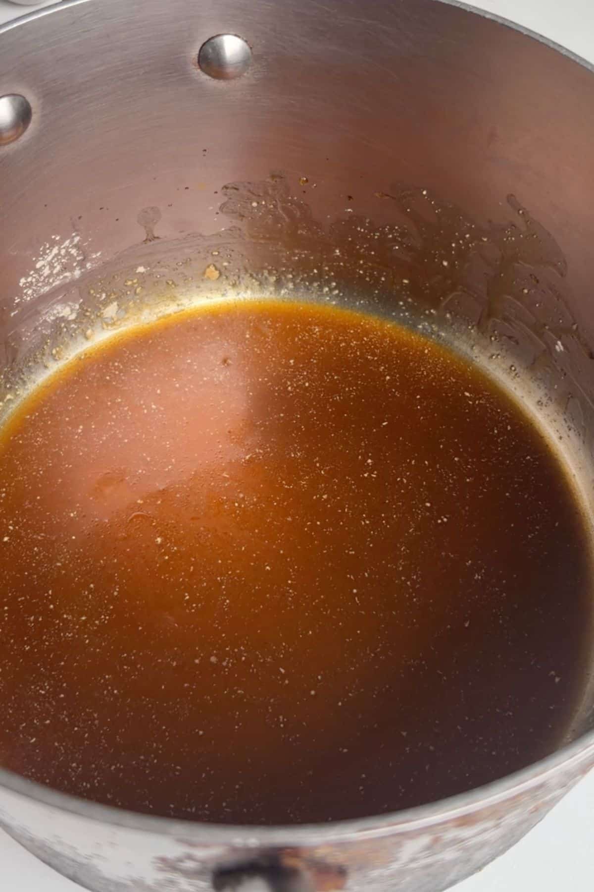 Maple glaze sauce in a pan.
