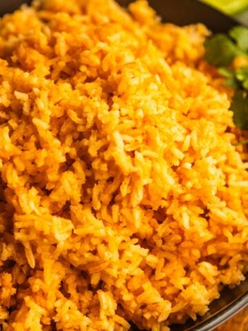 Mexican rice for tacos (simple Mexican rice) in a black bowl.