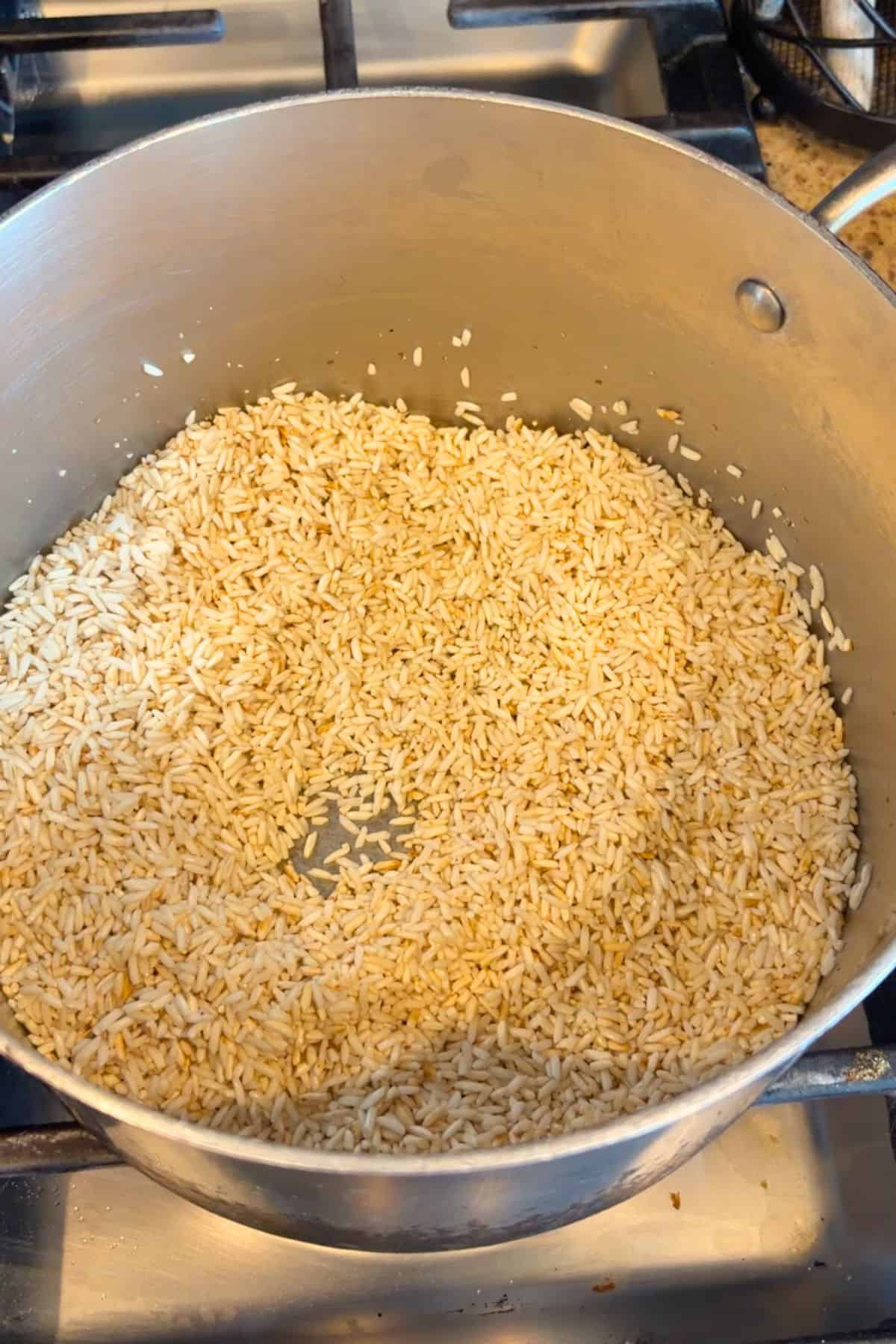 Rice toasting in a pan.
