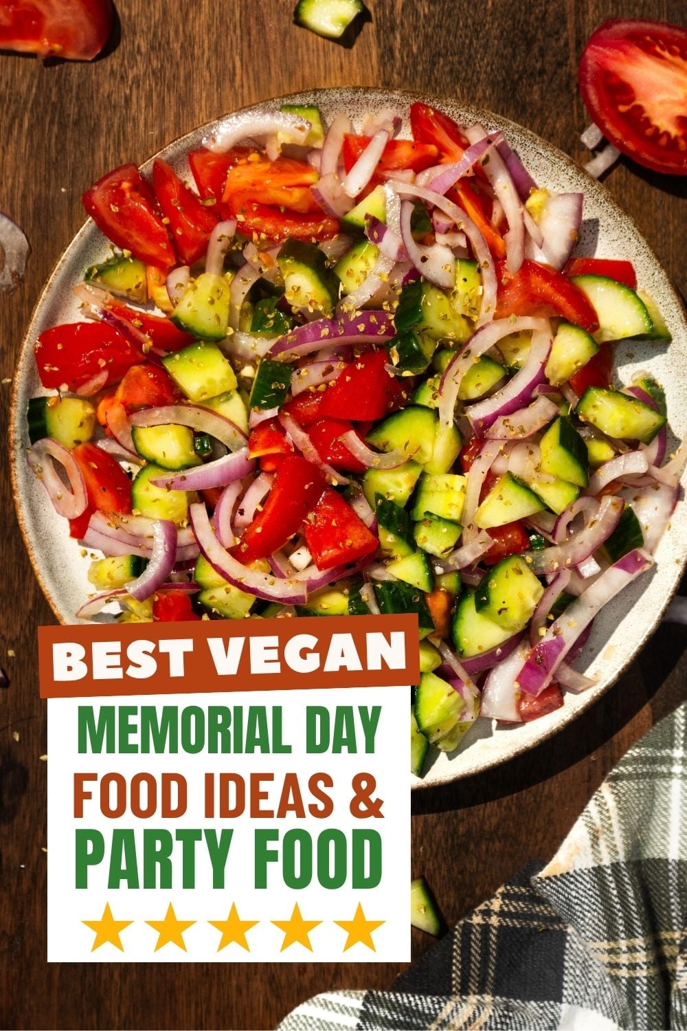 Cucumber tomato salad in a bowl with a napkin on the side.