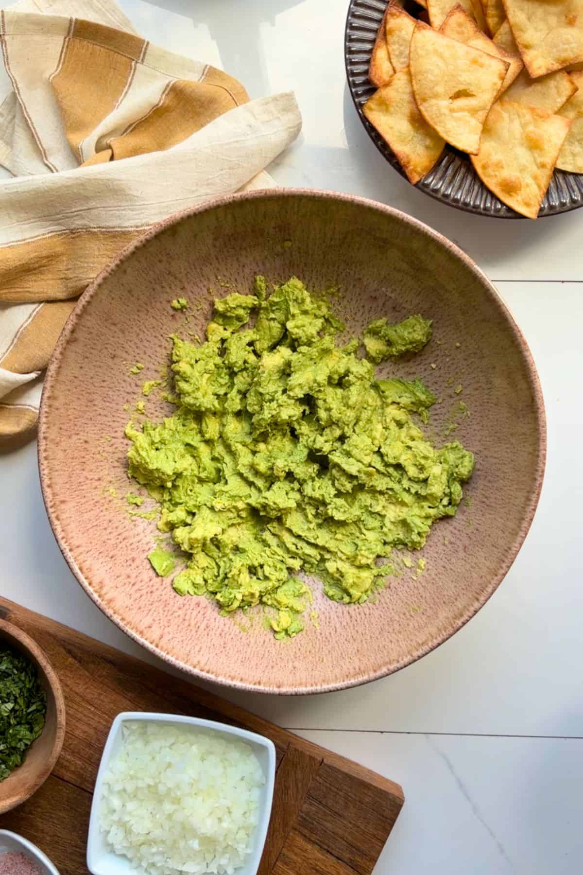 Mashed avocado in a bowl.