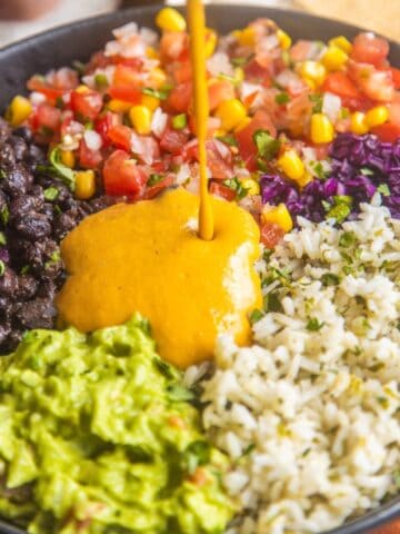 Mexican rice bowl recipe in a bowl with a napkin on the side.