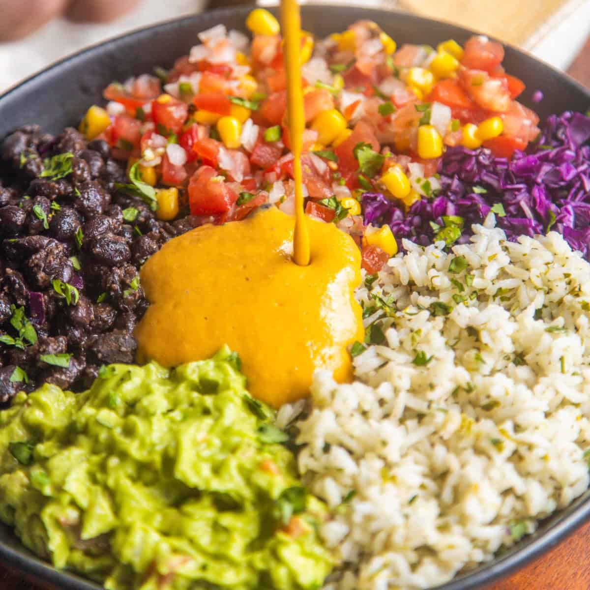 Mexican rice bowl recipe in a bowl with a napkin on the side.