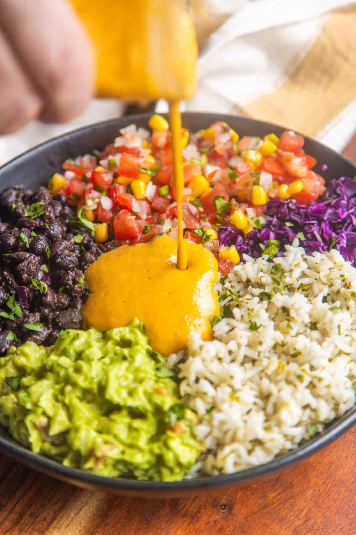 Mexican rice bowl recipe in a bowl with a napkin on the side.
