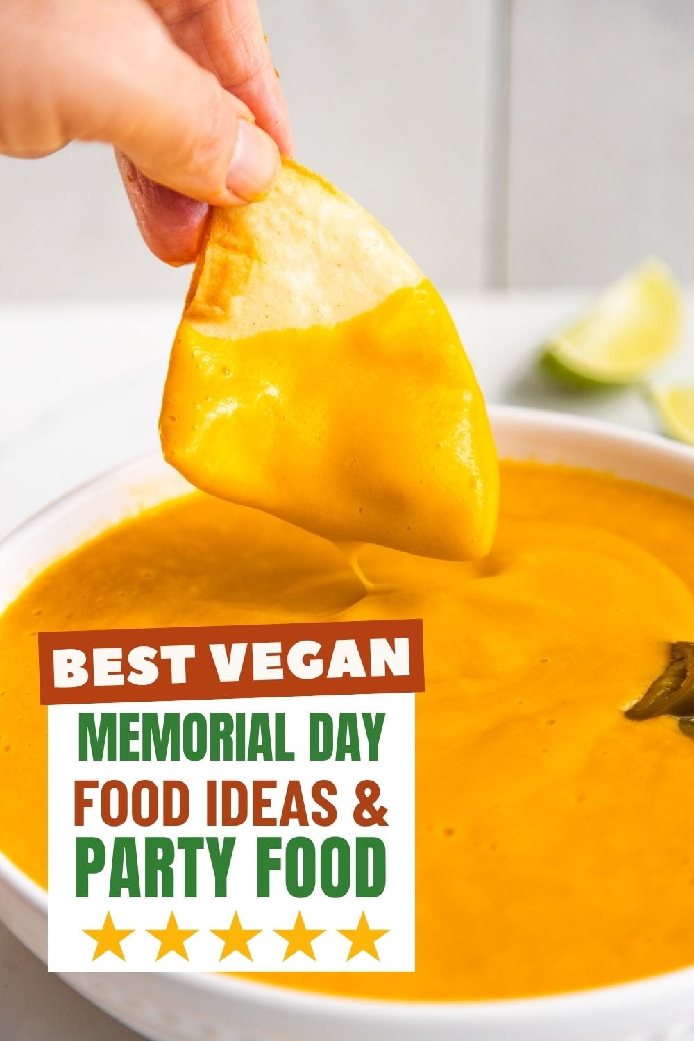 Vegan nacho cheese sauce in a bowl with a chip dipping in.