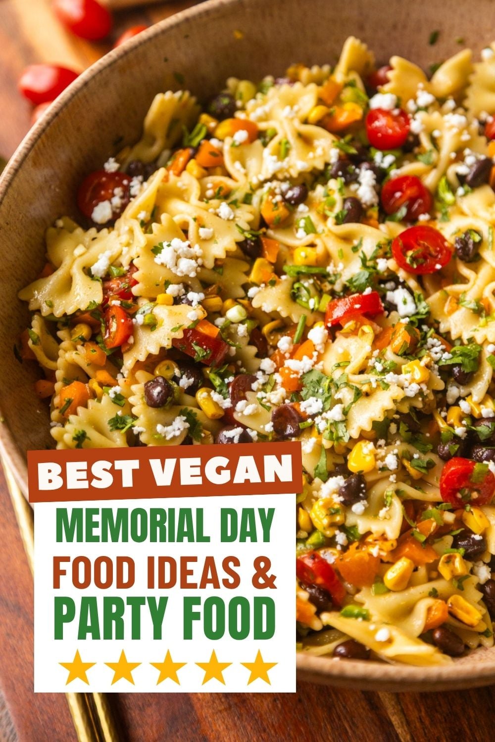 Southwest pasta salad in a bowl with salad spoons on the side.