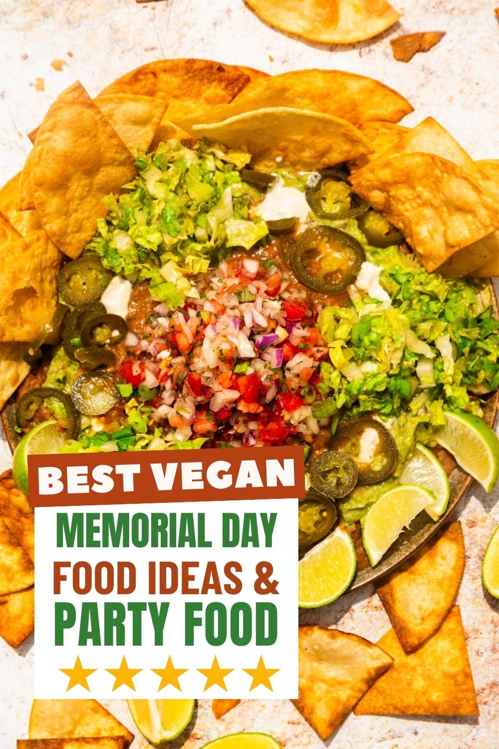 Vegan 7 layer taco dip in a bowl with chips on the side.