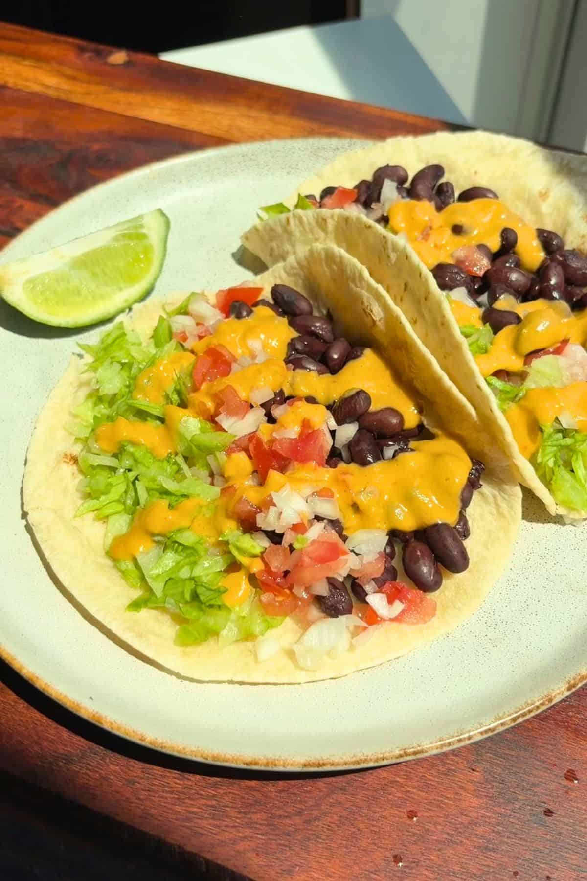Burrito bowl sauce drizzled over tacos.
