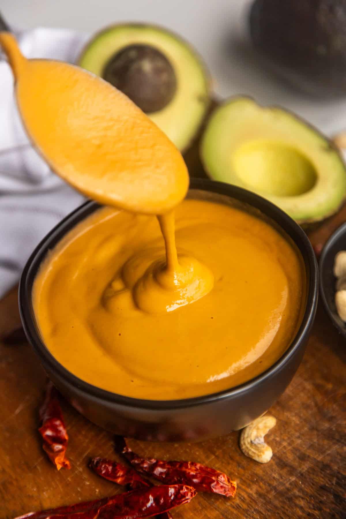 Creamy burrito bowl sauce recipe in a bowl with a spoon.