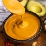 Creamy burrito bowl sauce recipe in a bowl with a spoon.