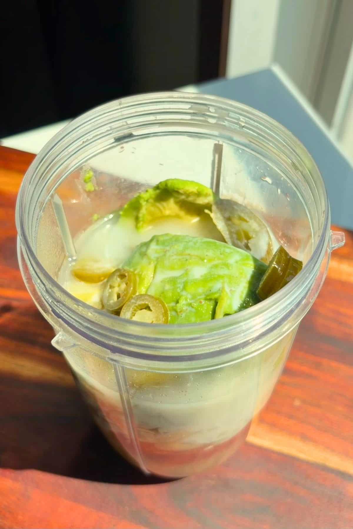 Boiled veggies and ingredients in a blender.